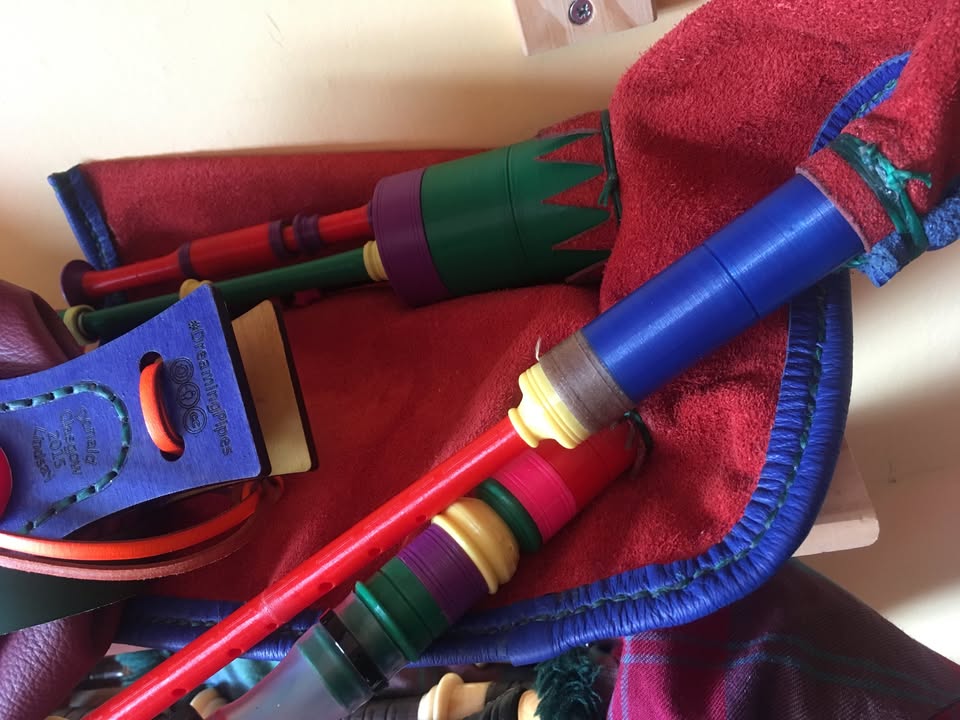 An earlier coloured set, with stocks tied into the bag.